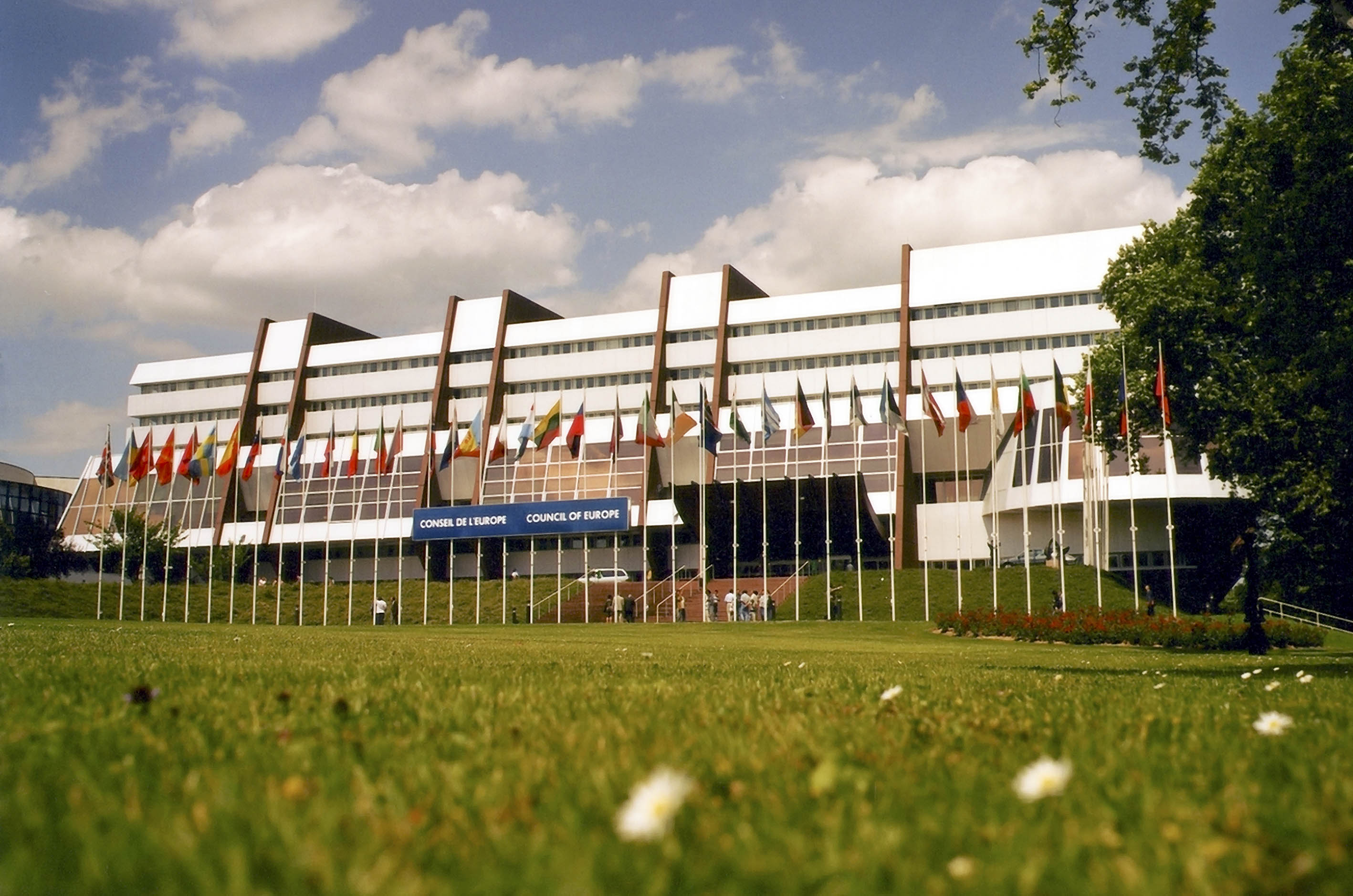 The Palace of Europe in Strasbourg and the flags of the member states of the Council of Europe.
